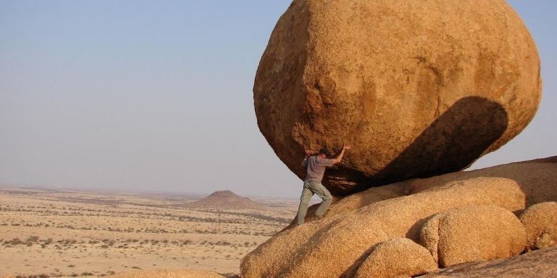 What are your signature strengths - man pushing large boulder uphill