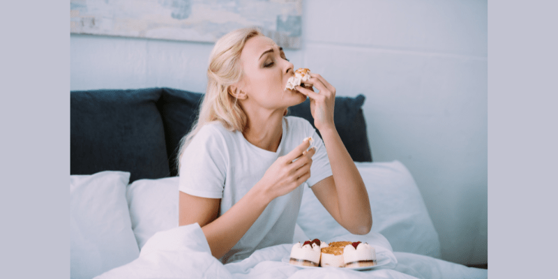 Woman binge eating pastries