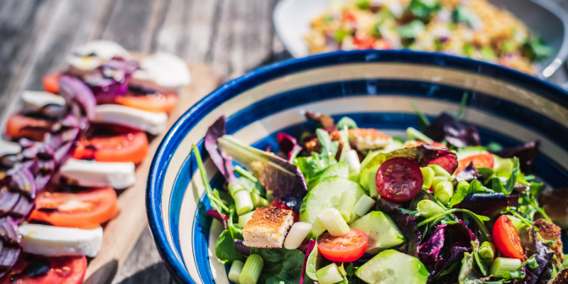 20 Ways to Improve your Diet - bowl of salad and other healthy dishes
