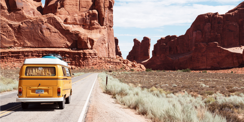 How to Use Integrative Wellness on Your Journey to Optimal Health - yellow VW bus on a road in the desert