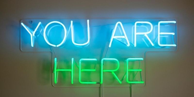 What is Mindfulness - blue and green neon sign with the words "you are here"