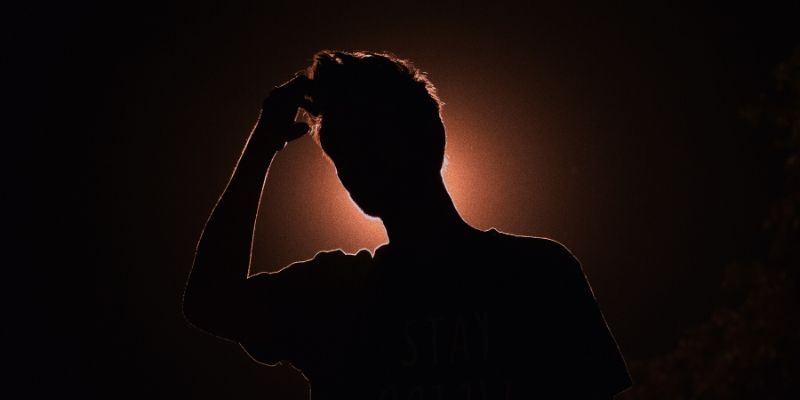 Identity Crisis - Person in silhouette pensive