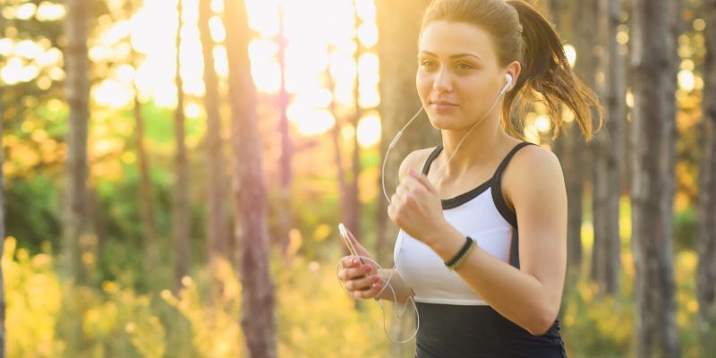 Optimal Health Quiz - woman running in nature