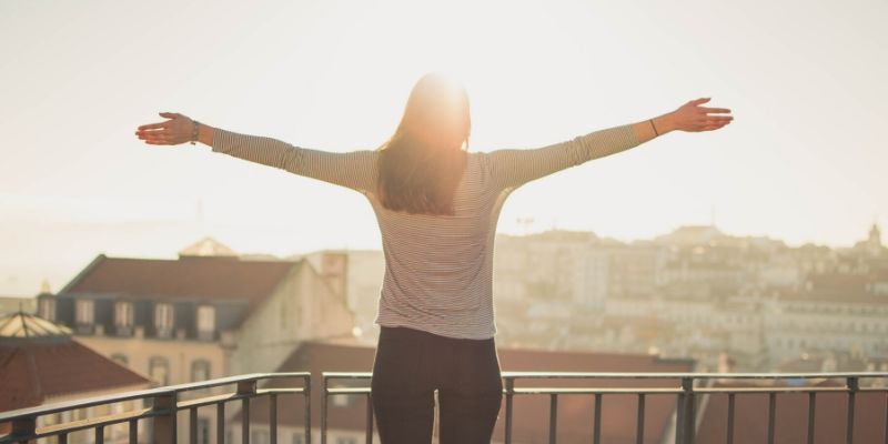 Optimal Health Quiz - woman with outstretched arms